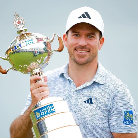 Nick Talyor holding the cup of Canadian Open.